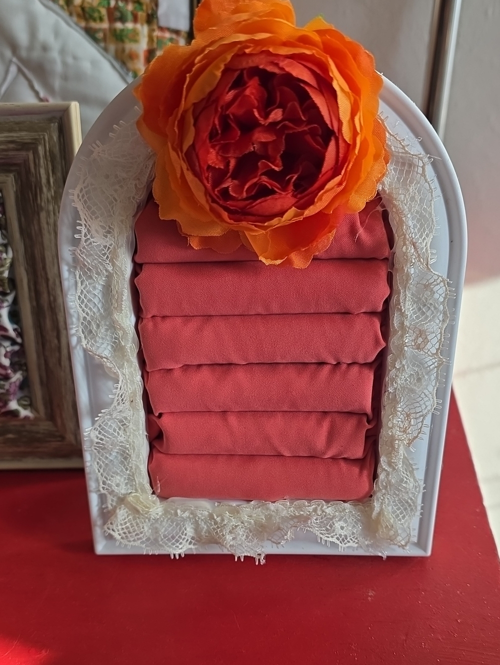Upcycled Ring Hilder In White Frame With Rust Colored Fabric And Orange Flower